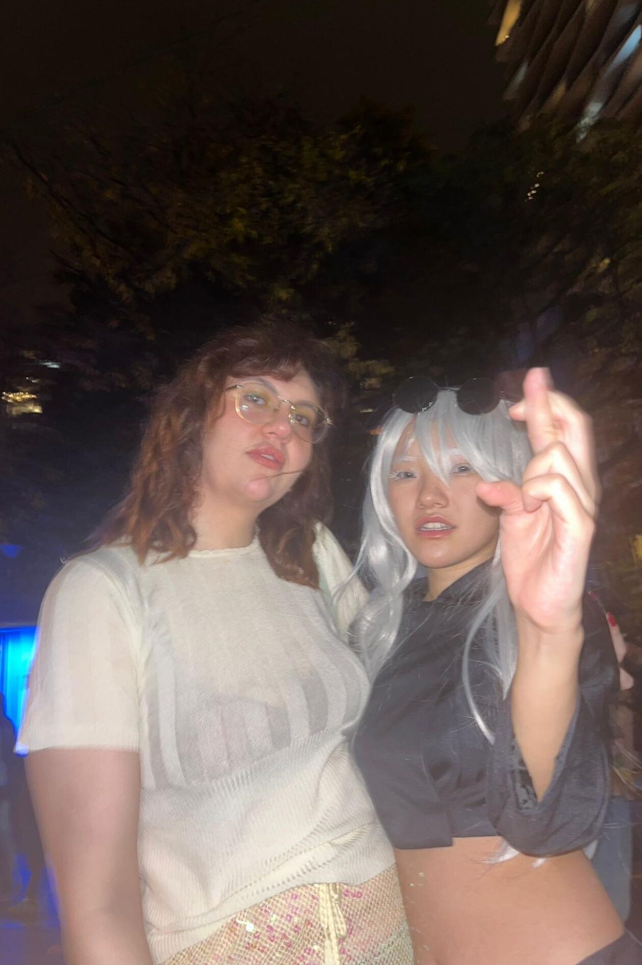 Portrait shot of a pair posing on Church Street, decked out in their costumes